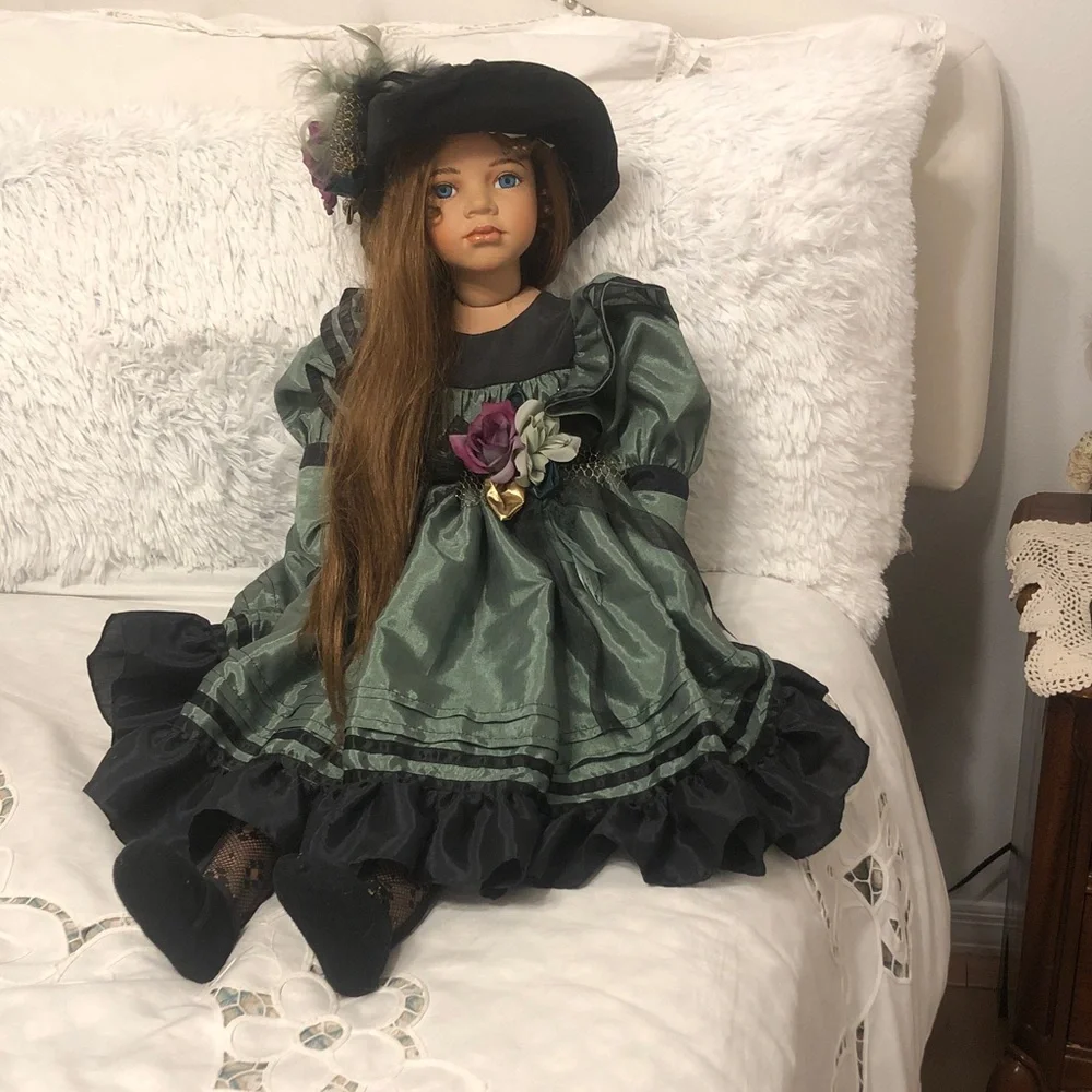 Vintage-Style Green & Black Porcelain Doll with Floral Accent